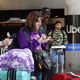 Travelers wait for an Uber ride at Midway International Airport on May 09, 2022 in Chicago, Illinois.